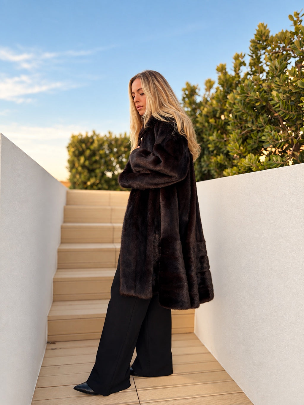 Dark brown oversized mink coat, side view